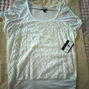 Cream colored top with lace front overlay.